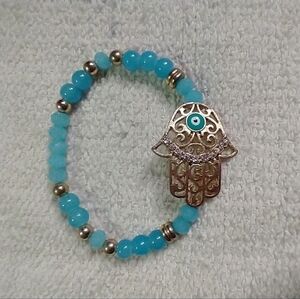 Goldtone blue beaded crystal eye hand stretch filigree bracelet
